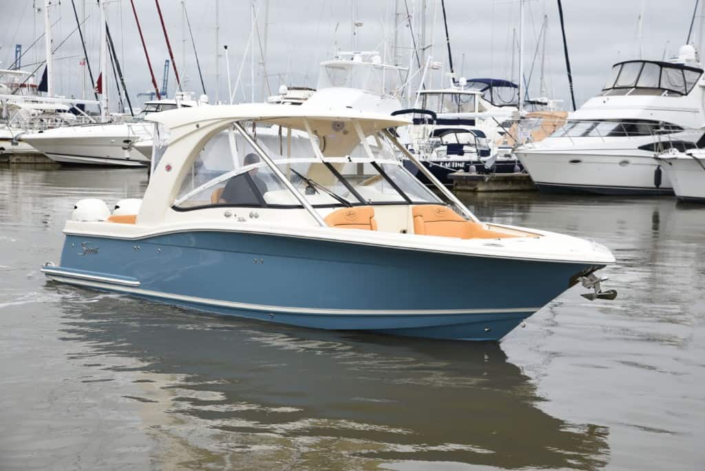 275D blue hull idling at marina